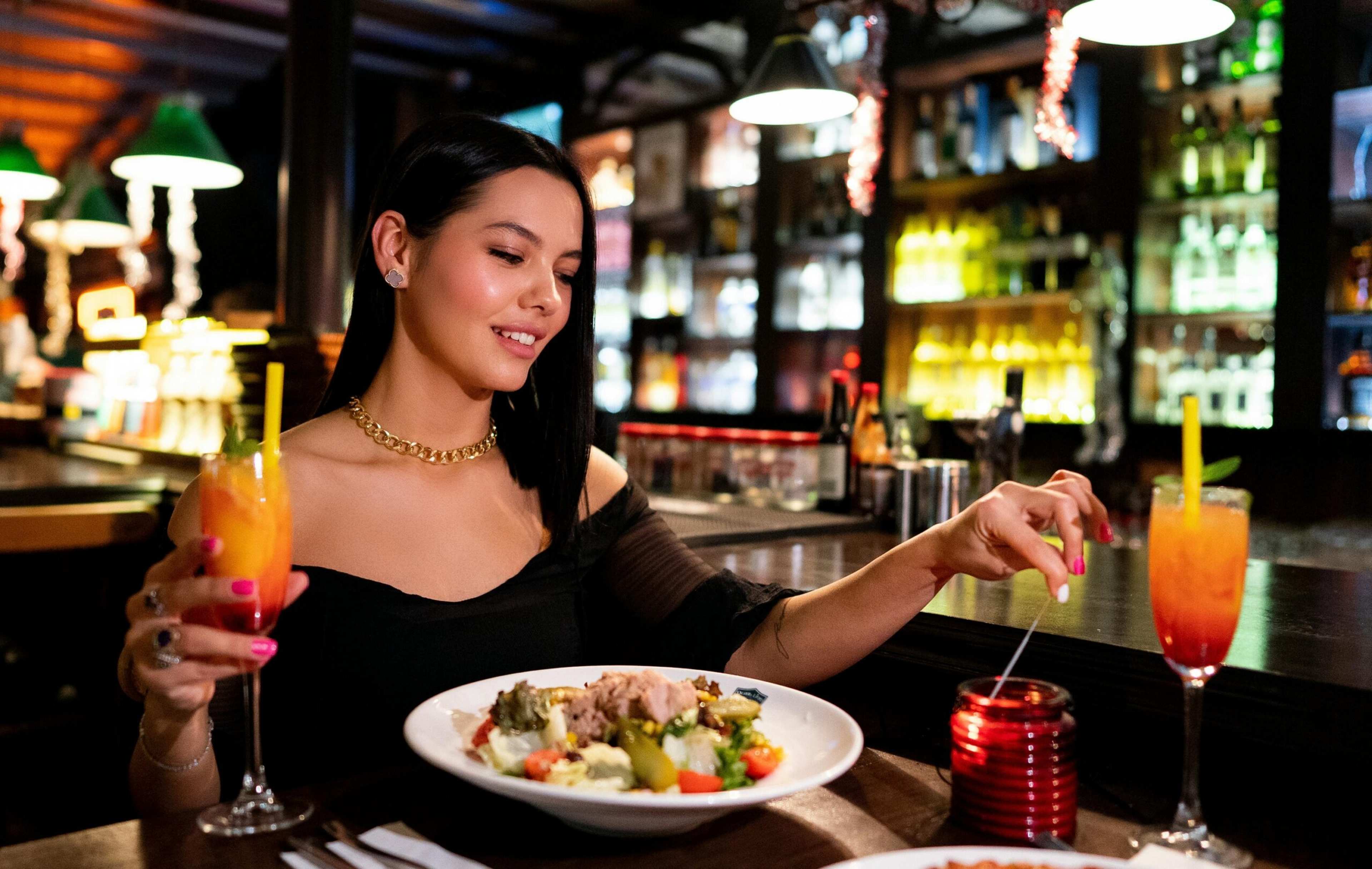 If You'd Rather Eat Dinner at a Bar Than a Table for One, You're Likely Utilizing a Specific Psychological Defense That Allows You to Be "In the World" Without Having to Risk the Vulnerability of Being Watched