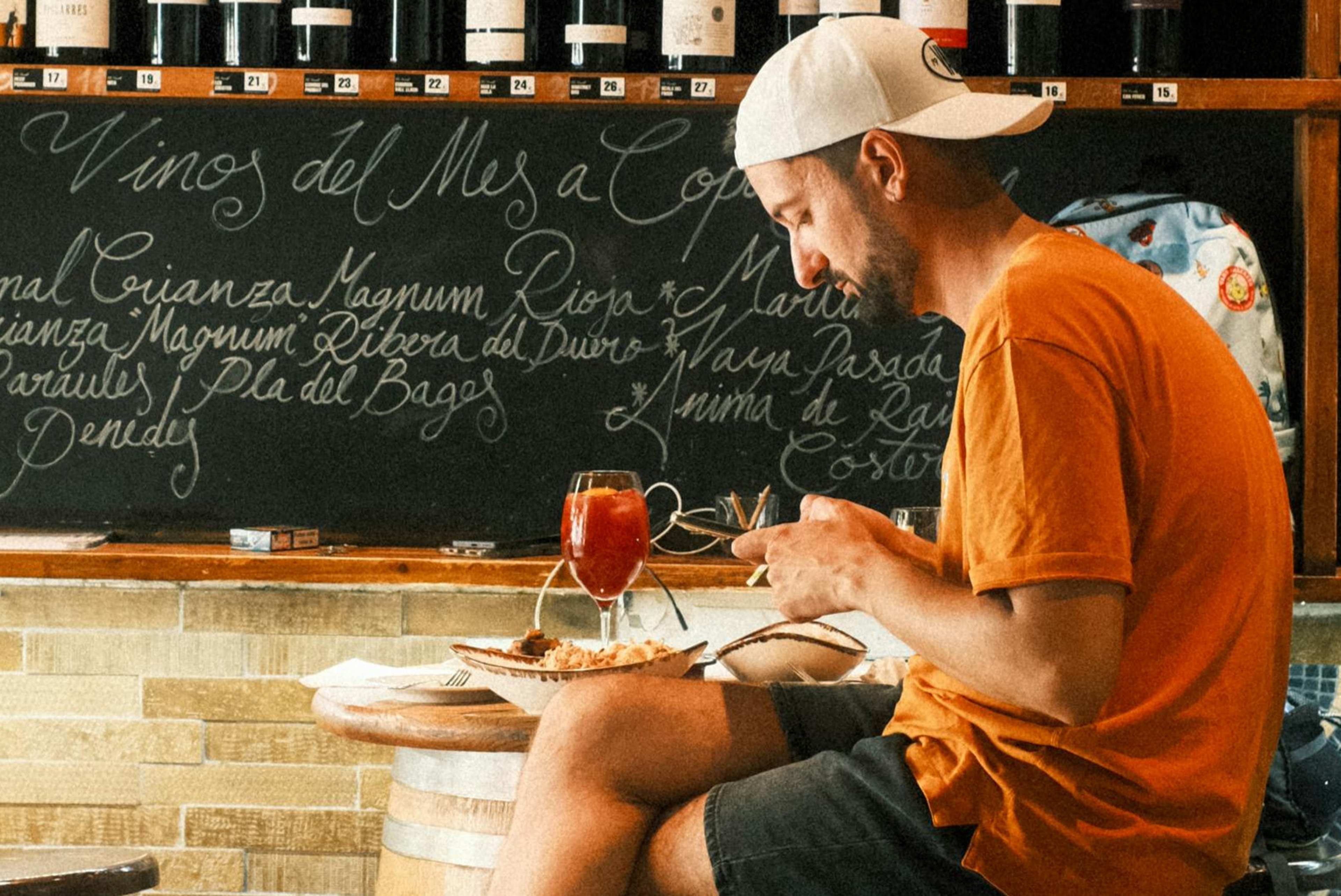 The Subtle Reason You Prefer Eating at the Bar Is That It Allows You to Be "In the World" Without the Pressure of Making Eye Contact
