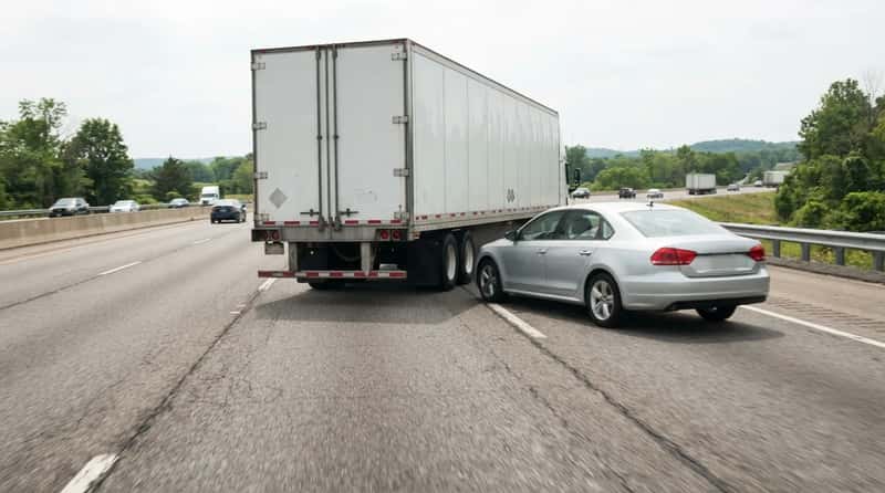 #5 - Sitting in a Truck's Blind Spot (Image Credits: Gemini)