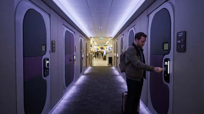 4. They Know When to Book a Sleep Pod or Transit Hotel (Image Credits: Gemini)