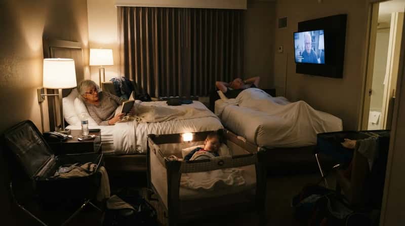 5. Booking a Single Hotel Room for Everyone (Image Credits: Gemini)