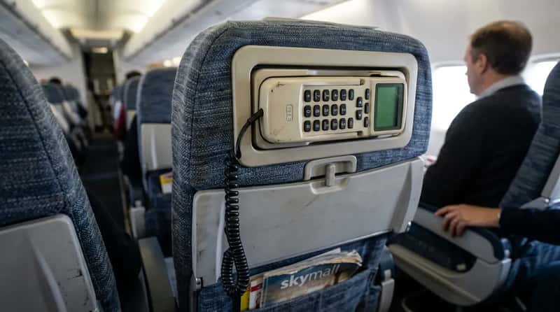 #6 - The Seatback Phone That Cost More Per Minute Than Most Meals (Image Credits: Gemini)