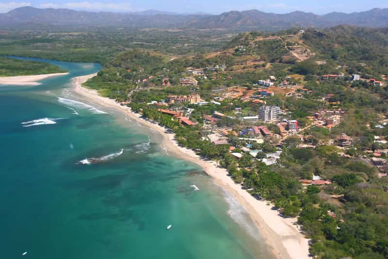 9. Growth and popularity are straining infrastructure in the towns foreigners love most (Tamarindowiki helicopter aerial photo, CC BY-SA 3.0)