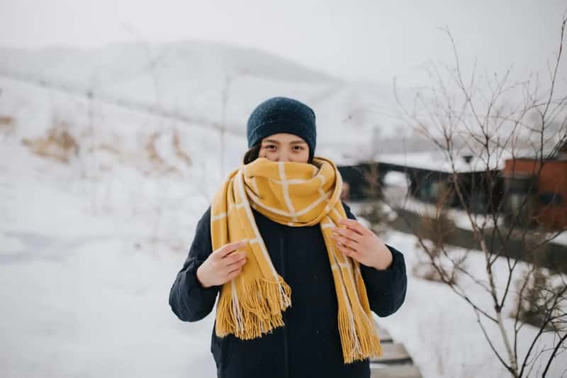 5. A lightweight packable jacket or scarf (Image Credits: Unsplash)
