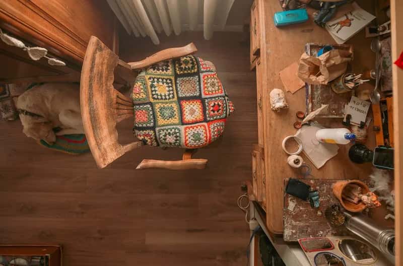 7. Burying the room in luggage and clothes so there's no room to work (Image Credits: Pexels)
