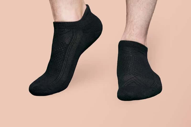 4. Dark or black socks, especially on overnight flights (Image Credits: Unsplash)