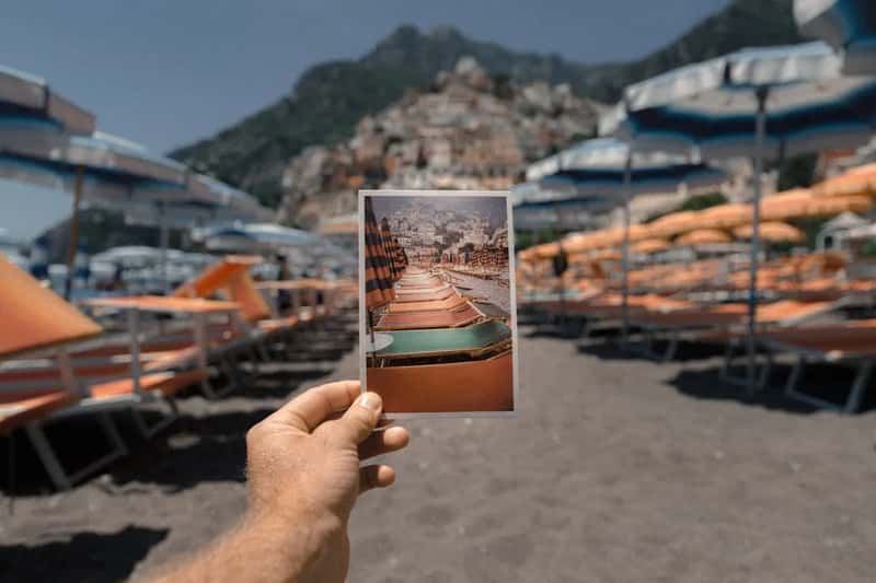 4. Being photographed and posting vacation photos online (Image Credits: Unsplash)
