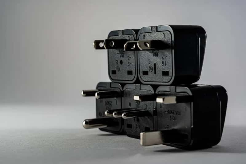 4. A universal travel adapter with USB ports built in (Image Credits: Pexels)