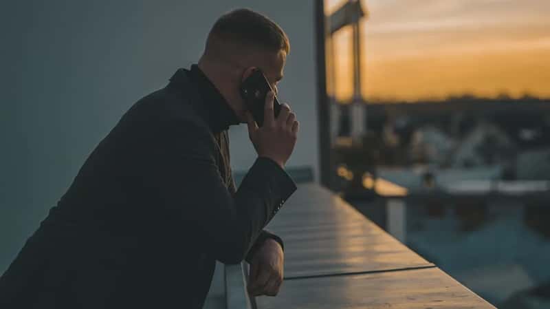 3. A quiet or delayed response from someone back home (Image Credits: Unsplash)