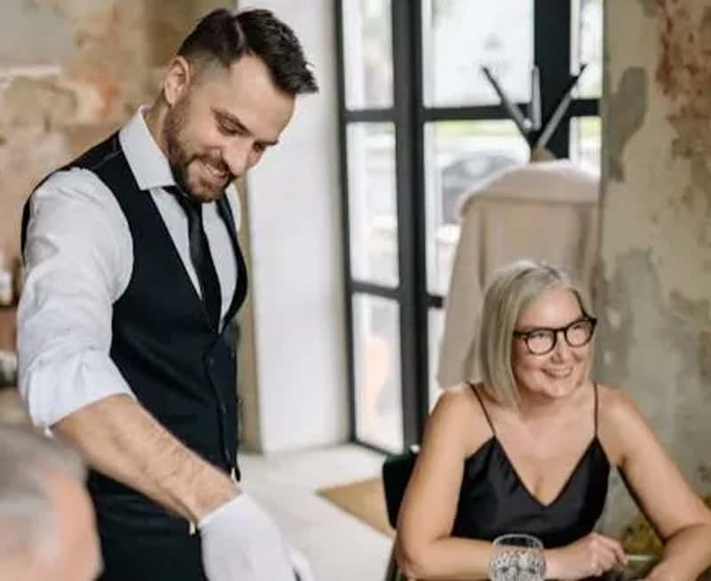 8. Ignoring the Server When They Approach (Image Credits: Pexels)