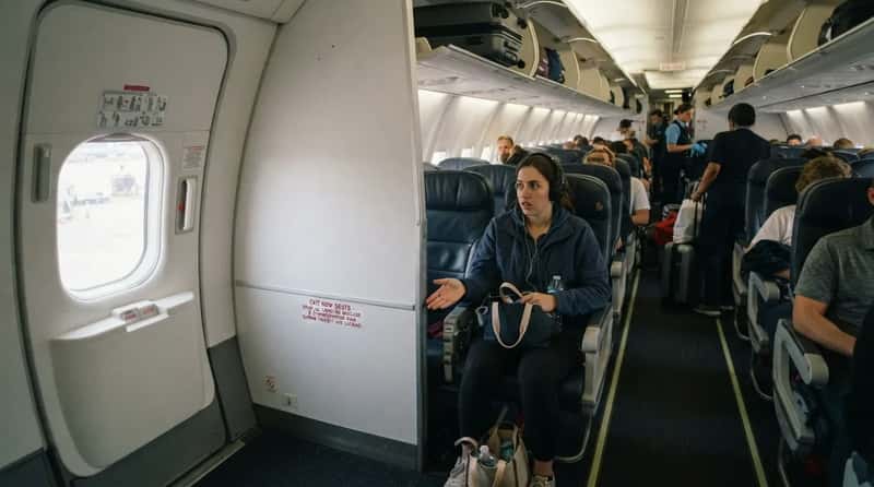 #5 - That Extra-Legroom Exit Row Comes With a Hidden Trade-Off (Image Credits: Gemini)