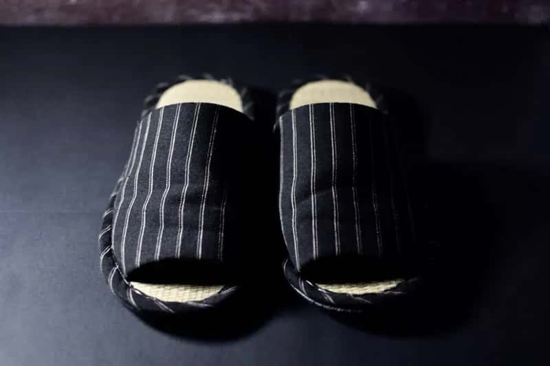 #11 - They Keep Non-Slip Footwear Right Next to the Bed (Image Credits: Unsplash)