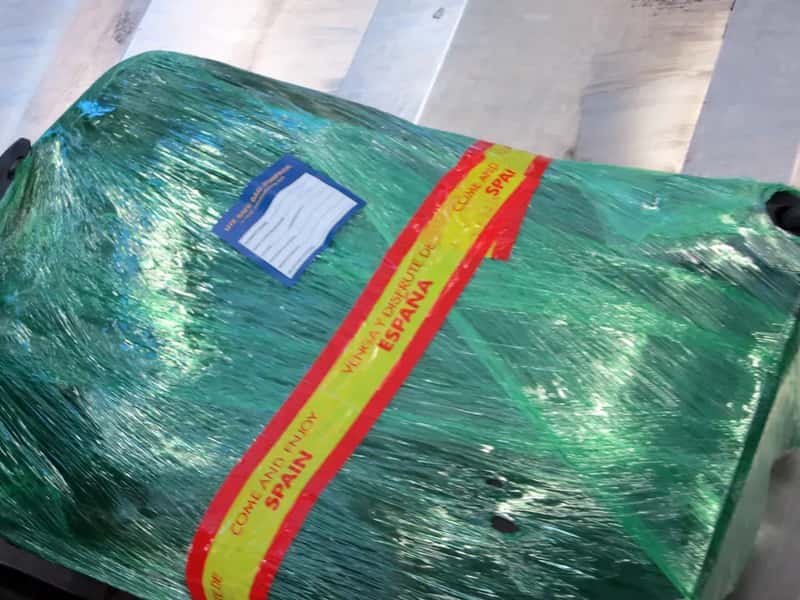 8. Consider Luggage Wrapping for Extra Security (Image Credits: Flickr)