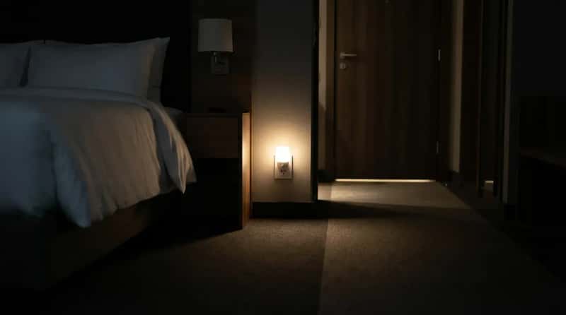 #11 - A Nightlight Left Glowing Between the Bed and the Bathroom Door (Image Credits: Gemini)