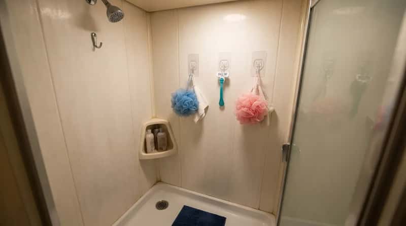 #16 - Line the Shower Wall With Waterproof Command Strips (Image Credits: Gemini)