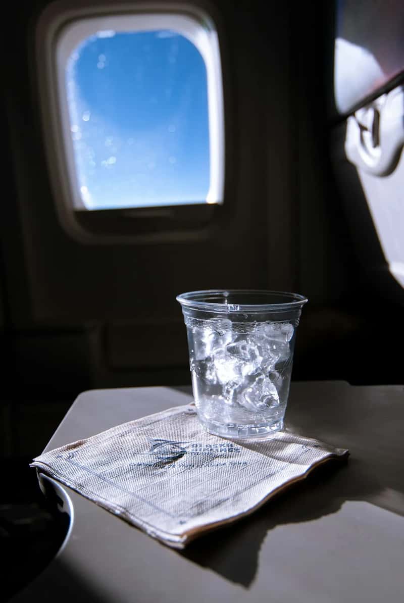 Alcohol hits differently in the air (Image Credits: Unsplash)
