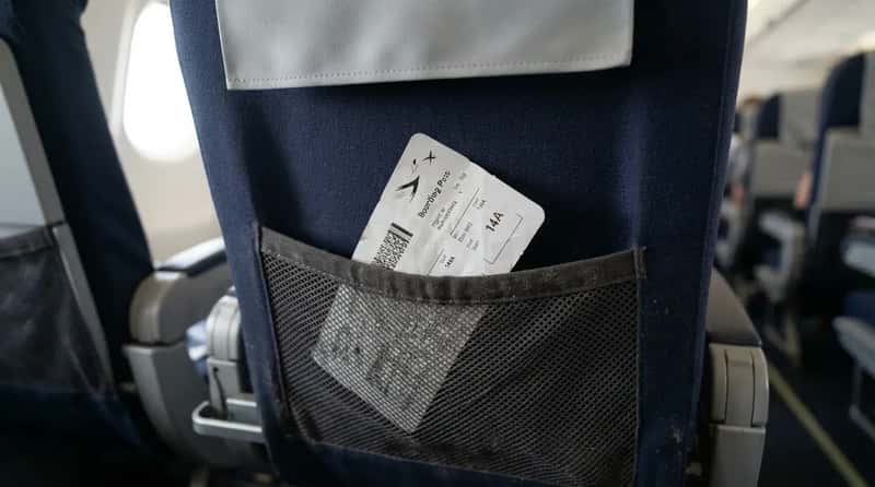 #10 - Leaving a Printed Boarding Pass in the Seat Pocket (Image Credits: Gemini)