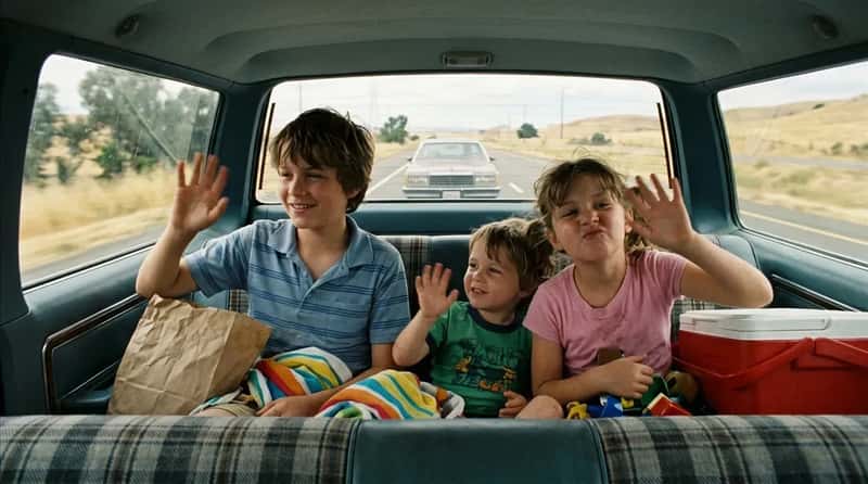 #14 - Kids in the Rear-Facing Back Seat, Waving (Image Credits: Gemini)