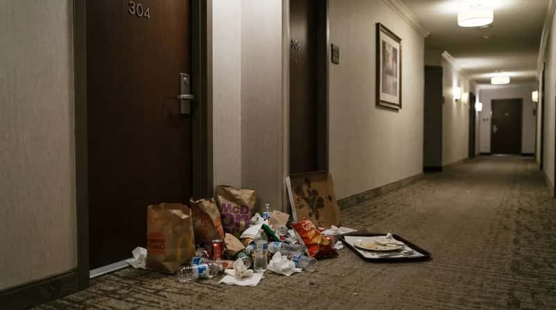 #15 - Piling Trash in the Hallway Instead of Using the Room's Own Bin (Image Credits: Gemini)