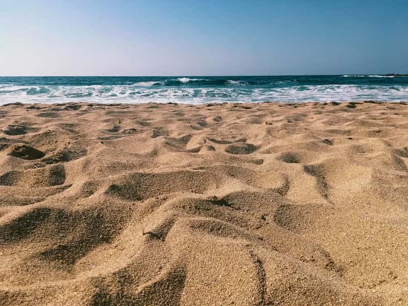 3. Beach Sand and Rocks (Image Credits: Unsplash)