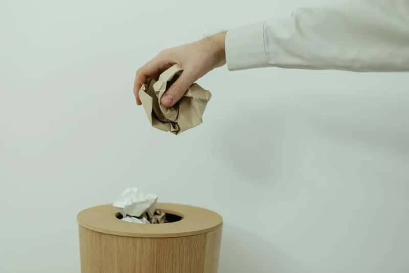 2. Scattering trash everywhere while the bin sits empty (Image Credits: Pexels)