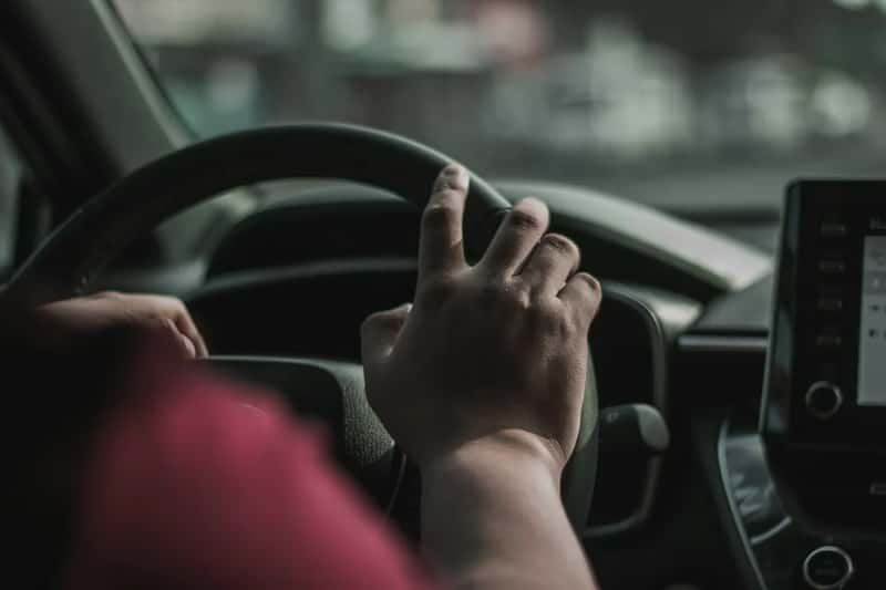 8. Waving at other drivers as a form of greeting (Image Credits: Unsplash)