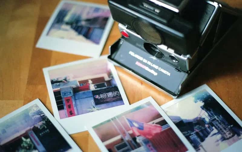 #8 - Snapping Vacation Photos on a Polaroid (Image Credits: Pexels)
