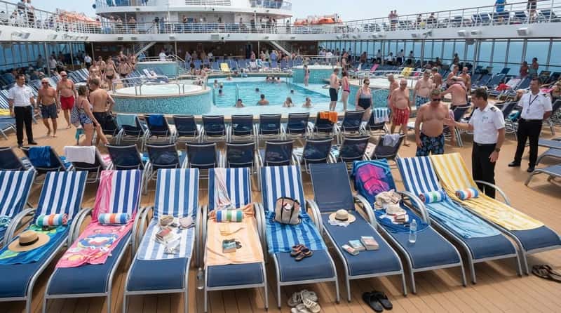 #6 - Hogging Pool Loungers With Towels For Hours (Image Credits: Gemini)
