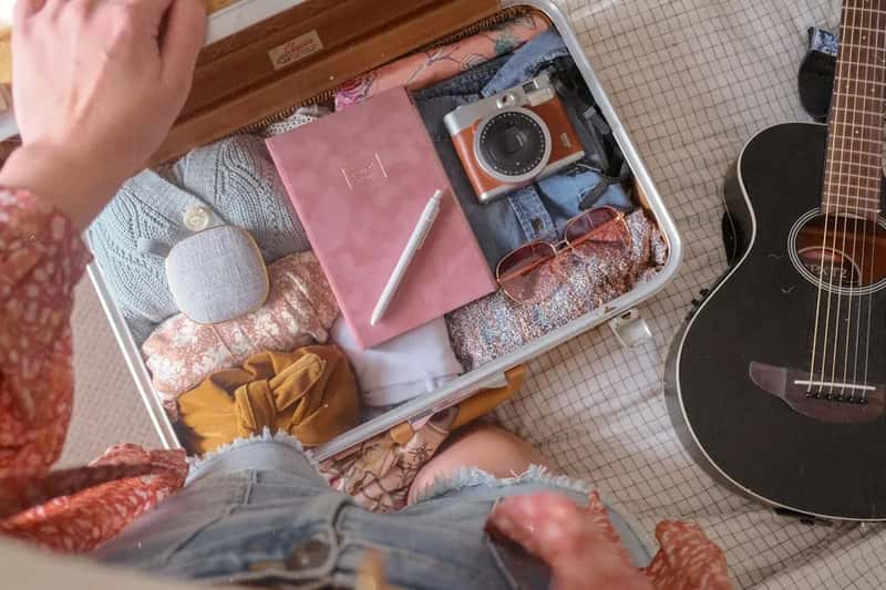3. Burying the passport at the bottom of a checked bag (Image Credits: Unsplash)