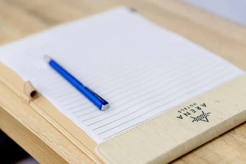 7. They Pocket Hotel Pens, Notepads, and Slippers as Keepsakes (Image Credits: Pexels)