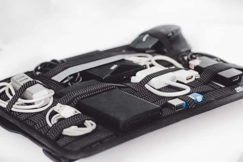 11. A dedicated tech pouch with cables coiled and labeled (Image Credits: Unsplash)