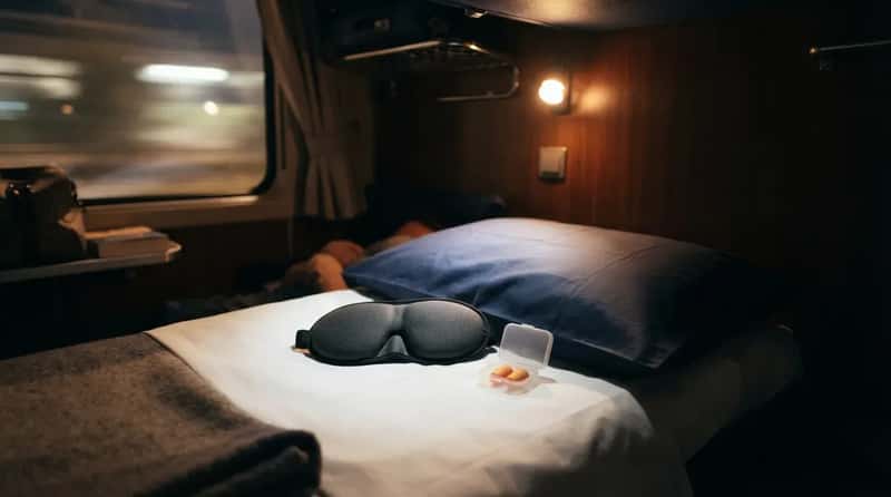 7. They Lay Out Earplugs and an Eye Mask Before Bed, Not During It (Image Credits: Gemini)
