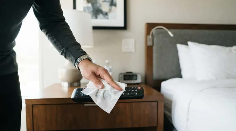 7. They Wipe Down the Remote Before They Touch Their Face (Image Credits: Gemini)