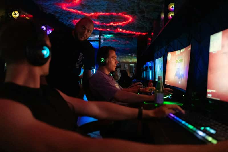 15. Watching partners play video games at gaming cafes abroad (Image Credits: Unsplash)
