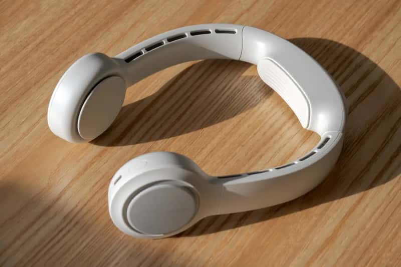 4. Handheld neck fans with loose spare batteries (Image Credits: Unsplash)