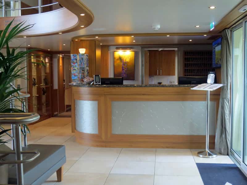 4. Waiting past embarkation day to ask guest services (Flickr: River Venture 017 Navigator Deck-Reception-Hospitality Desk, CC BY-SA 2.0)