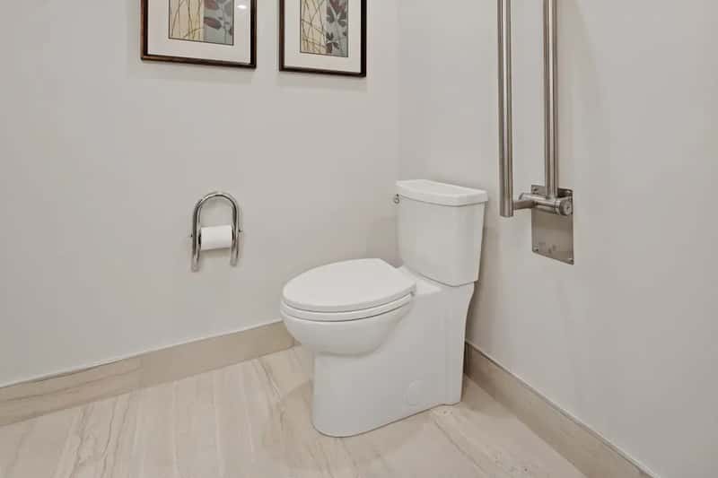 #6 - They Install a Raised Toilet Seat With Armrests (Image Credits: Unsplash)