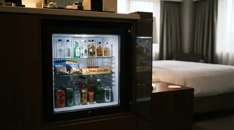 #3 - Full Mini-Bars Stocked With Snacks and Booze Are Disappearing (Image Credits: Gemini)