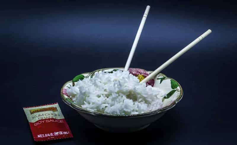 Sticking Chopsticks Upright in Your Rice (Image Credits: Flickr)