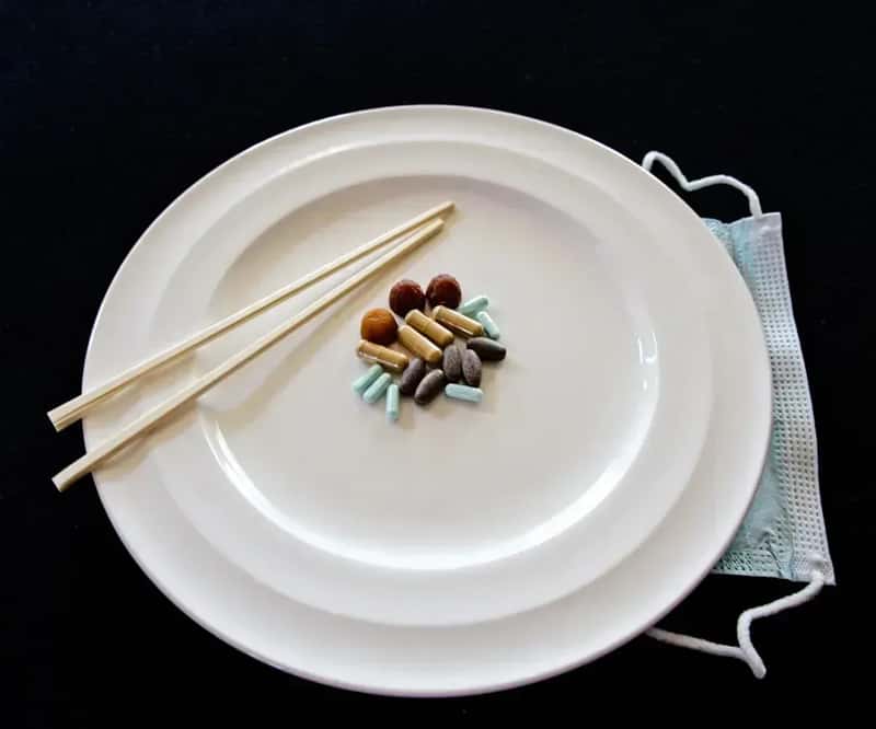 Misusing Chopsticks at the Dinner Table (Image Credits: Unsplash)