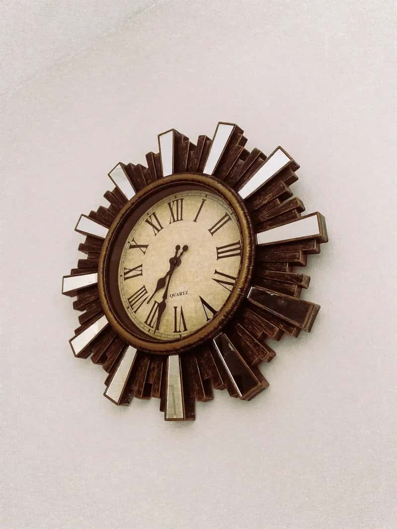 #23 - Sunburst Clocks Hung on Paneled Walls (Image Credits: Unsplash)