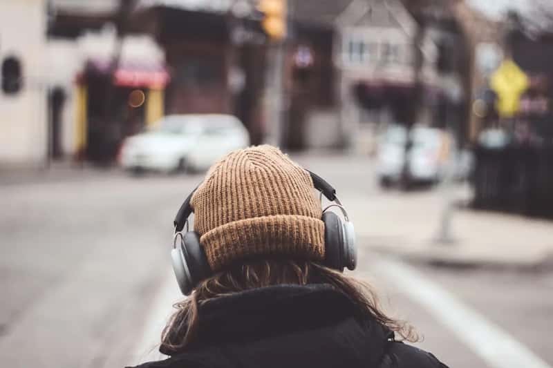 5. Playing music or videos out loud without headphones (Image Credits: Unsplash)