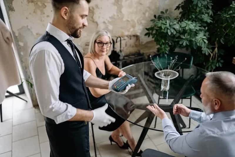 2. "Is the Tip Included?" (Image Credits: Pexels)