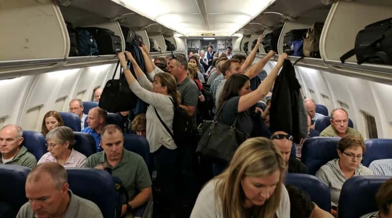 #5 - Sprinting for the Aisle the Moment the Plane Stops at the Gate (Image Credits: Gemini)