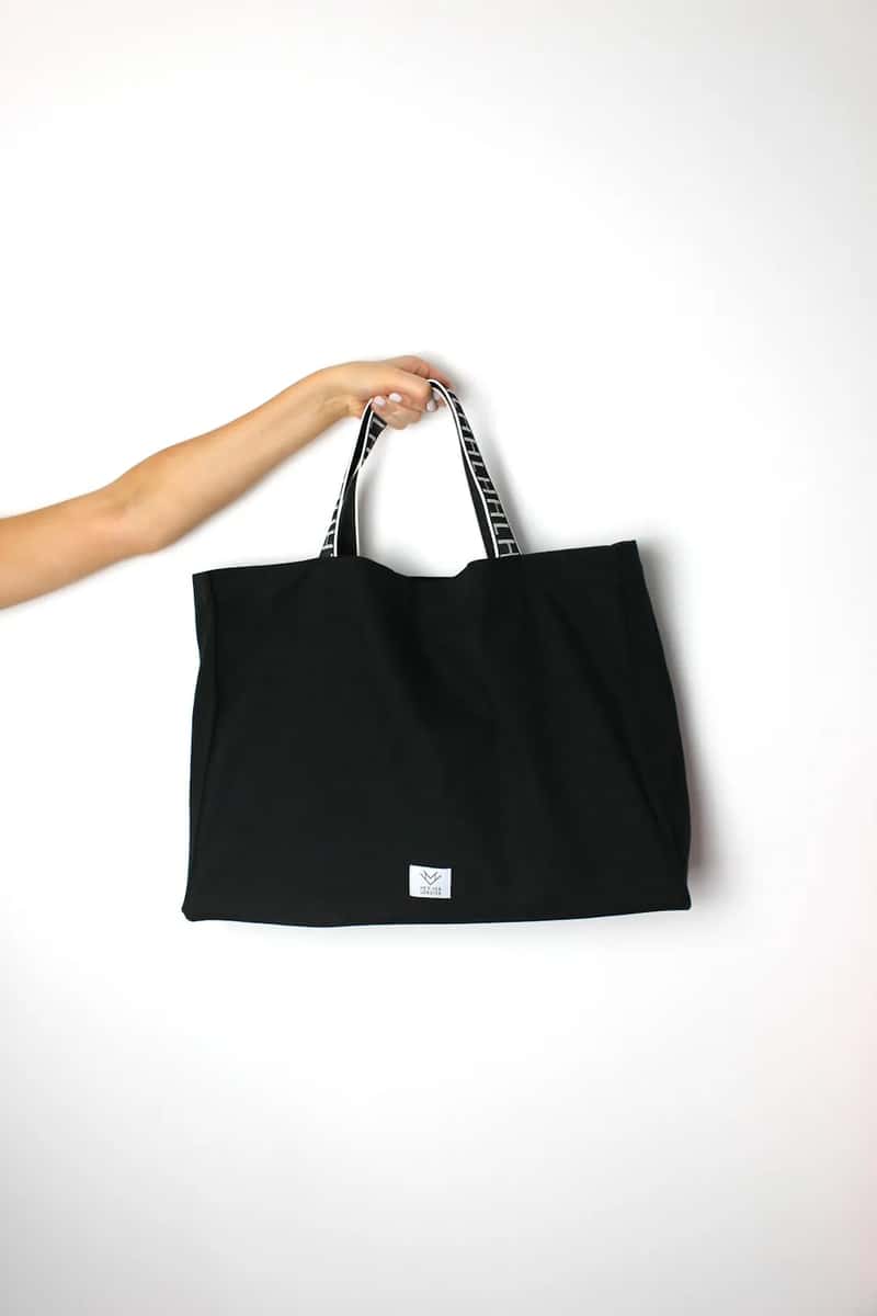 10. A collapsible tote or extra bag folded into the main carry-on (Image Credits: Unsplash)