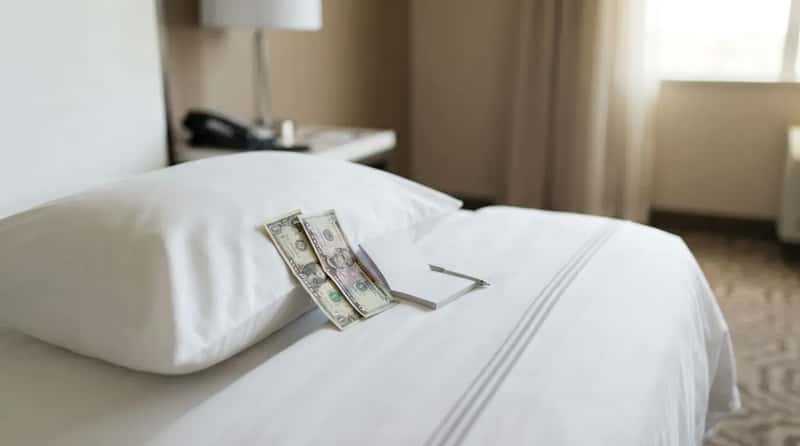 #4 - The Cash on the Pillow Debate That Divides Housekeepers and Guests (Image Credits: Gemini)