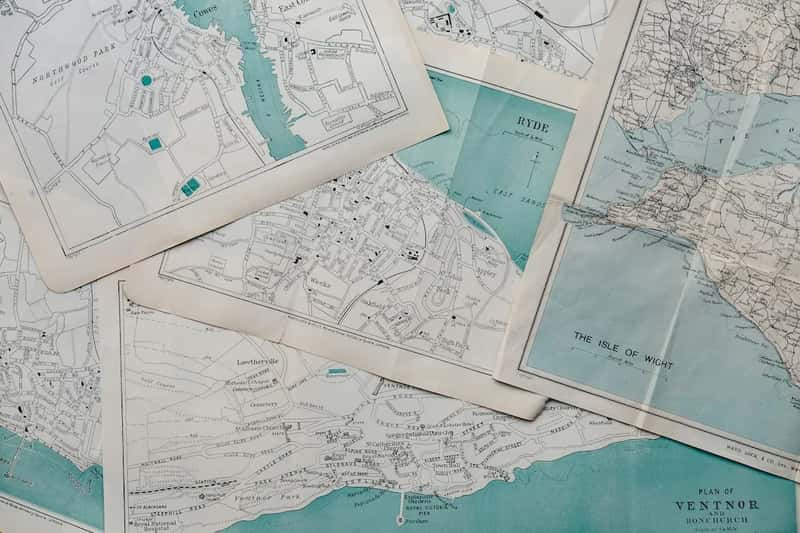 2. Printed paper maps (Image Credits: Unsplash)