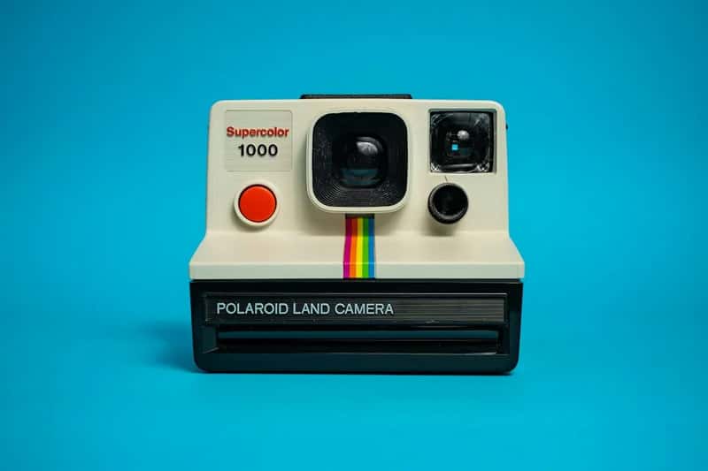 Snapping a Polaroid and watching the picture appear (Image Credits: Unsplash)