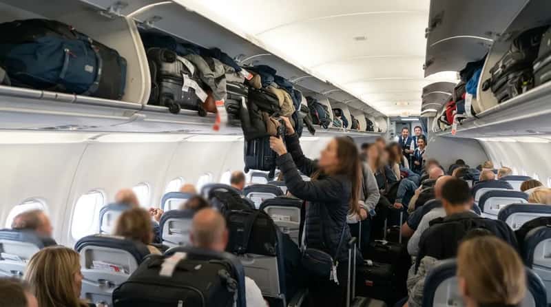 #14 - Stuffing Every Overhead Bin Within Reach (Image Credits: Gemini)