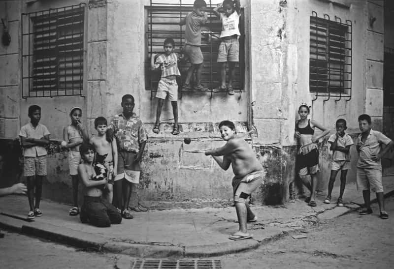 #7 - Playing Stickball in the Street and Pausing for Cars (originally posted to Flickr as Boys Playing Stickball, Havana, Cuba, 1999, CC BY 2.0)